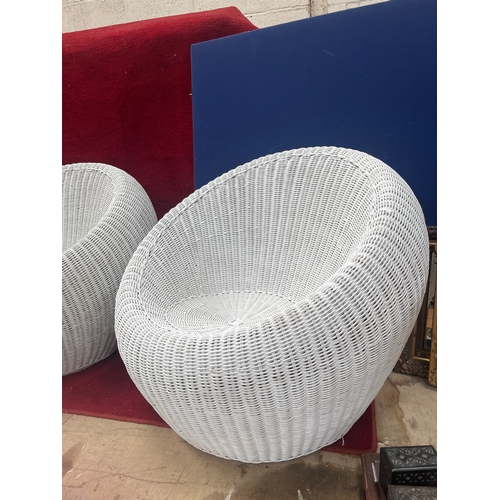 399A - Pair of 1970’s rattan pod chairs in white finish