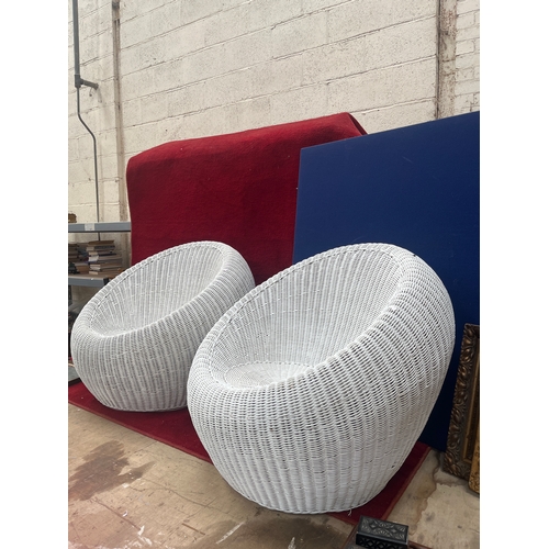 399A - Pair of 1970’s rattan pod chairs in white finish