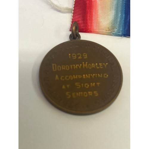 47 - Ealing Music Festival Medallion 1929, a  vintage 1960s I.E.E. stick pin features the 