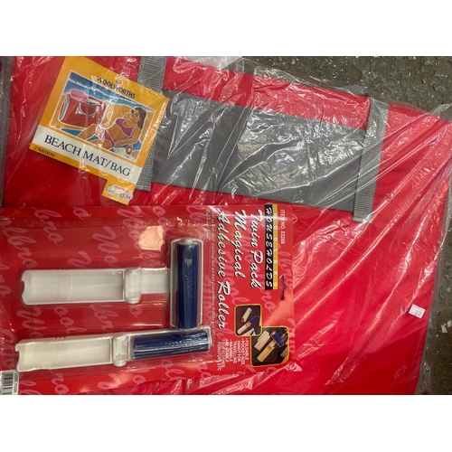 256 - Useful lot ( mostly new/packaged)includes beach mat/bag, multi-purpose cloths, superglue, cookie cut... 