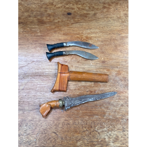64 - A small&nbsp;Indonesian kris (or keris) dagger with wavy blade and wooden sheath, together with two ... 