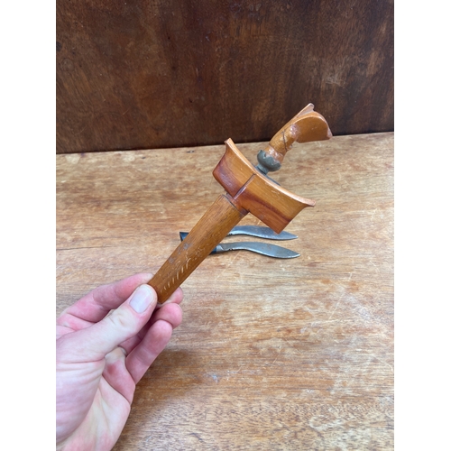 64 - A small&nbsp;Indonesian kris (or keris) dagger with wavy blade and wooden sheath, together with two ... 