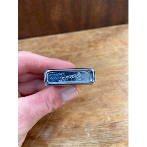 61 - Vintage Zippo cigarette lighter featuring a printed 