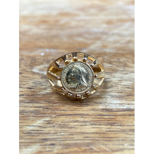 31 - Queen Victoria 22ct 1/8 sovereign, set in an open patterned work 18ct gold ring. Total weight 4.54g.... 
