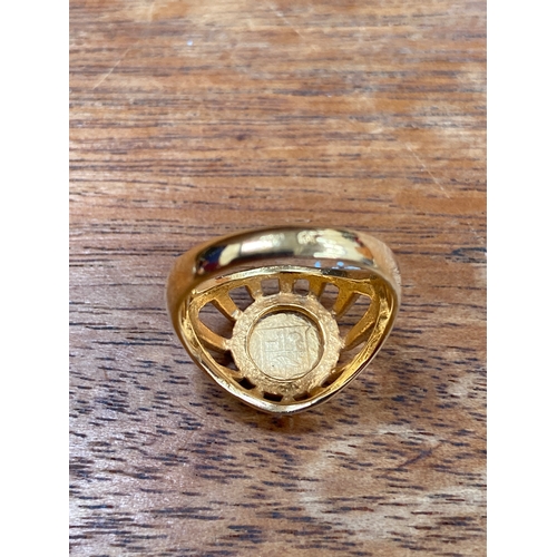 31 - Queen Victoria 22ct 1/8 sovereign, set in an open patterned work 18ct gold ring. Total weight 4.54g.... 
