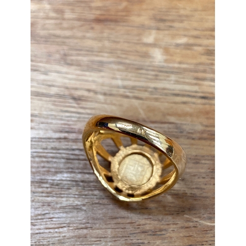 31 - Queen Victoria 22ct 1/8 sovereign, set in an open patterned work 18ct gold ring. Total weight 4.54g.... 