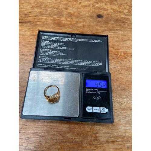 31 - Queen Victoria 22ct 1/8 sovereign, set in an open patterned work 18ct gold ring. Total weight 4.54g.... 