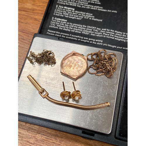 32 - 9.44g of scrap 9ct gold, including a couple of necklaces, Dennison watch back, section of fob chain ... 