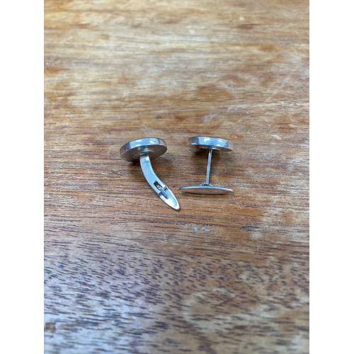 34 - Pair of sterling silver St. George cufflinks. 10.03g total weight.