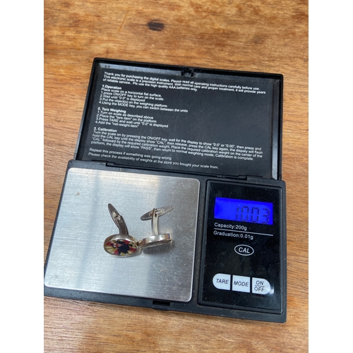 34 - Pair of sterling silver St. George cufflinks. 10.03g total weight.