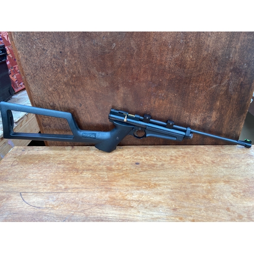 36 - Crosman 2250B Rat Catcher CO2-powered air rifle featuring a synthetic stock and a .22 caliber barrel... 