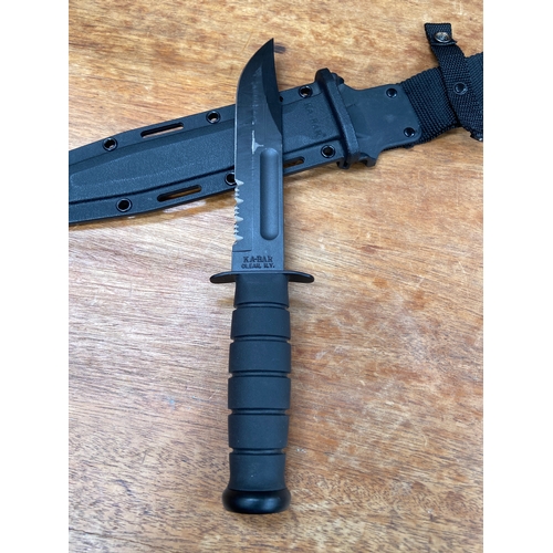 38 - KA-BAR 1211 USMC Fighting/Utility knife, featuring a 7-inch partially serrated carbon steel blade wi... 