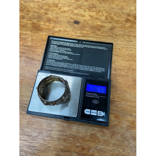 45 - Antique sterling silver napkin ring from British India, early 20thC featuring intricate repoussé dec... 