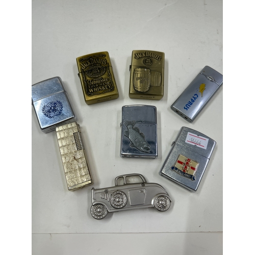 collectable cigarette lighters Eight novelty & collectable cigarette lighters including Jack Daniel's,  Zippo United Natio