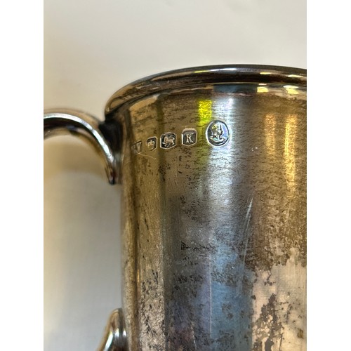 15 - A sterling silver christening mug (hallmarked Sheffield 1952) and a silver egg cup (gilt lined) with... 