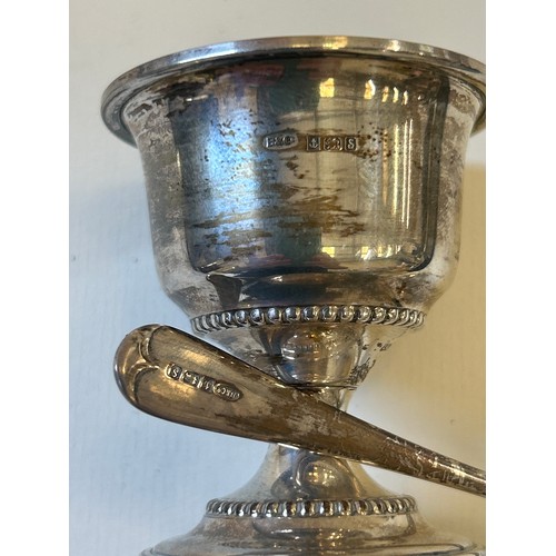 15 - A sterling silver christening mug (hallmarked Sheffield 1952) and a silver egg cup (gilt lined) with... 