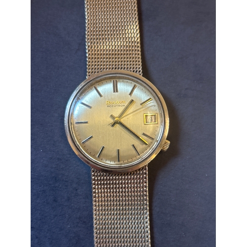 26 - 9ct gold Bulova Accutron wrist watch with gold strap. All parts marked .375. Complete with original ... 