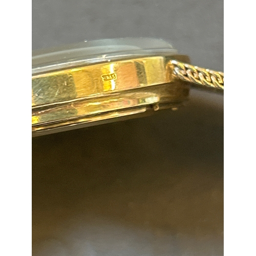 26 - 9ct gold Bulova Accutron wrist watch with gold strap. All parts marked .375. Complete with original ... 
