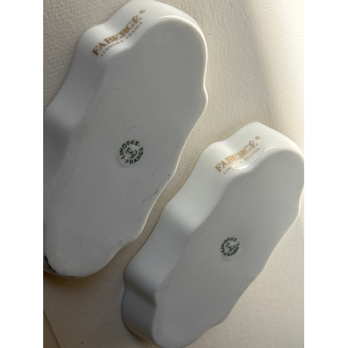 32 - Pair of Limoges France porcelain cigar ashtrays decorated with Faberge eggs. &nbsp;
