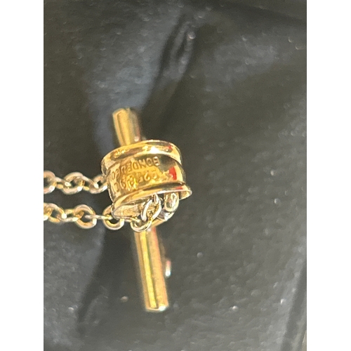 34 - Silver and 9ct bonded gold crucifix on chain, the box marked Chisholm & Hunter 1857