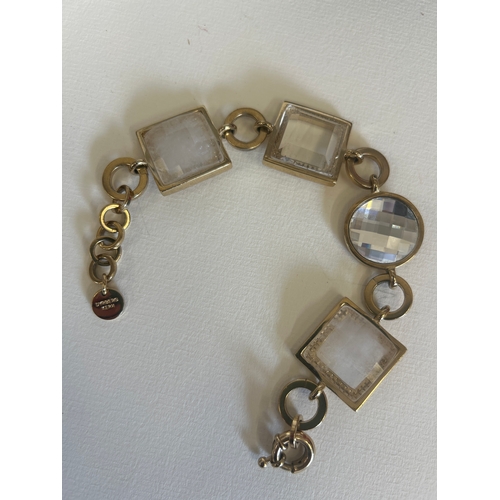 35 - A Dyrberg Kern rock crystal designer bracelet with large square and round settings. The box marked &... 
