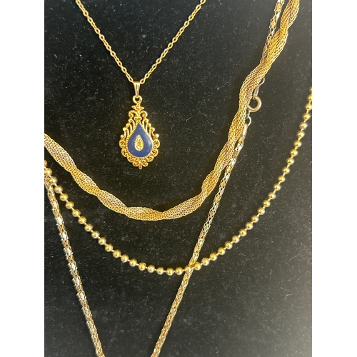 37 - Selection of gold plated necklaces and a ladybird pendant watch