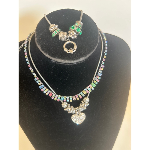 38 - Selection of costume jewellery necklaces & charm bracelet . Includes original Christian Dior box... 