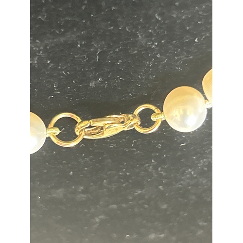 40 - Three beautiful cultured pearl necklaces to include one with a heavy 9ct gold clasp.&nbsp;