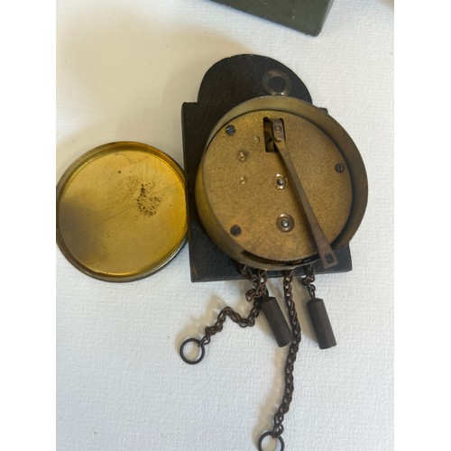 43 - Vintage miniature Black Forest clock with original box and a remote control “Guess who farted” novel... 