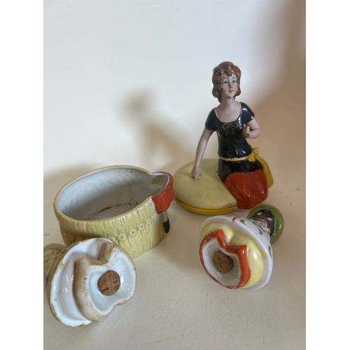 52 - Art Deco ceramics to include a continental powder jar with lady seated to lid (damage to fingers) an... 