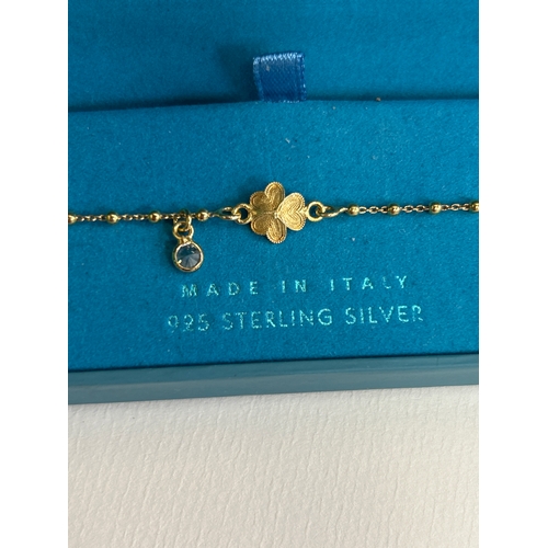 47F - A 925 sterling silver gilt bracelet with a Shamrock & rhinestone drop