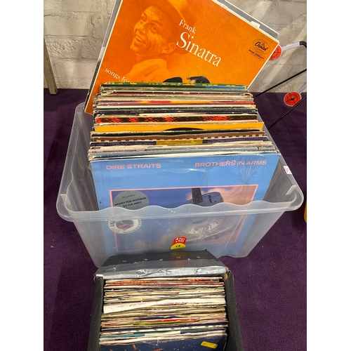 Stack of LP records, & vinyl case of 45s. Dire Straits, Duran Duran ...