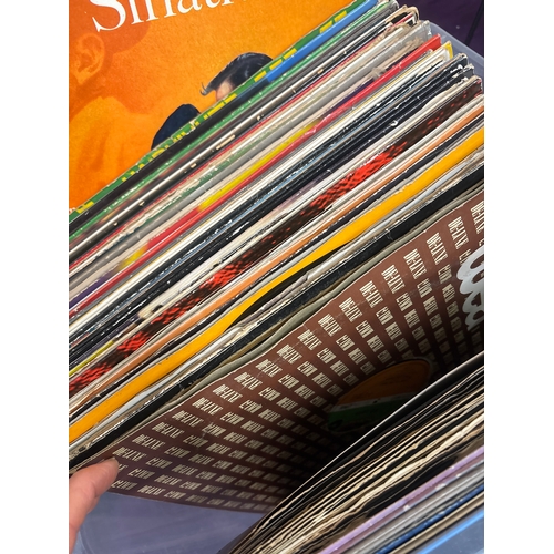 Stack of LP records, & vinyl case of 45s. Dire Straits, Duran Duran ...