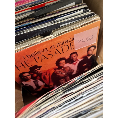 2 boxes full of vintage 45 rpm records. Mixed genre.