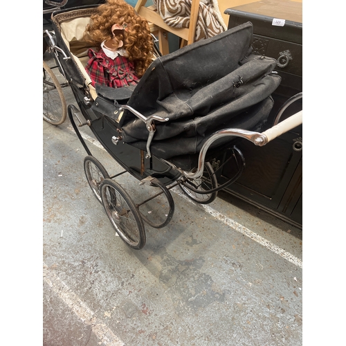 Vintage coach-built twin dolls pram, featuring two porcelain collector ...