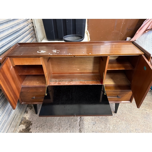Mid-century “LINK” sideboard featuring drop-front desk section.