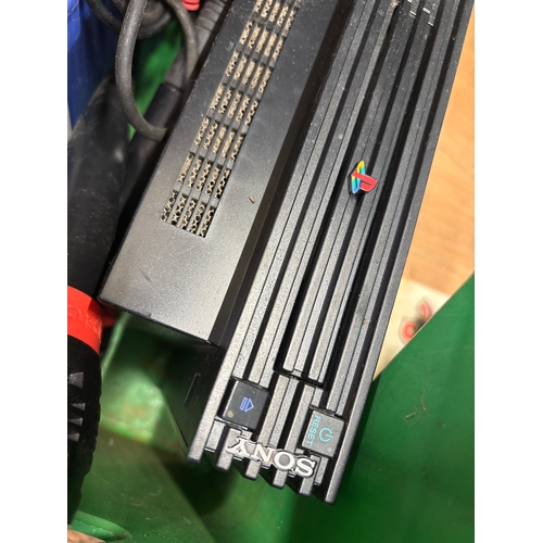 Sony PlayStation 2 console bundle with a stack of PS2 games, SingStar ...