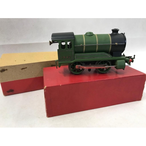 406 - Hornby 0 Guage clockwork 4 wheel loco no 501 in green, reversing, with paperwork & key 
 Condition 1... 