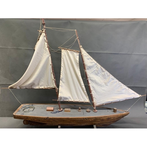 1 - An antique wooden model sailing boat on stand