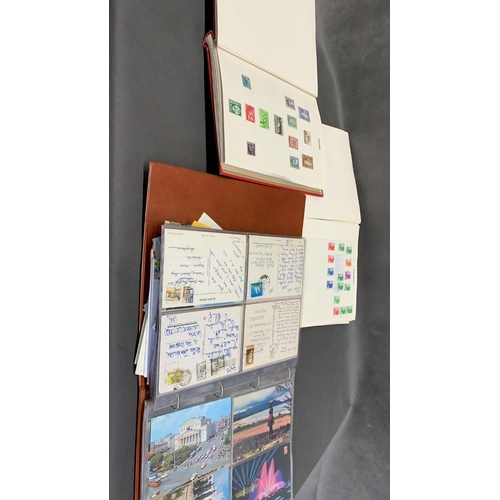 104 - 4 albums of world stamps together with an album of 20th century postcards and 1 album of Great Brita... 