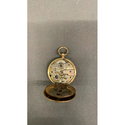 151 - An 18 carat gold ladies fob watch, with a silver face, in need of a service, presently not working. ... 