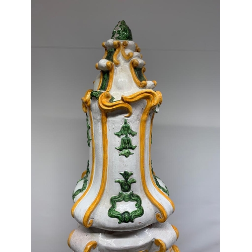 182 - A large Italian majolica terracotta parlour oven with a white, green and yellow glaze, standing 6 fe... 