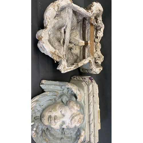 2 - 2 antique French plaster cast corbels in the form of cherum faces, adorned with angel wings