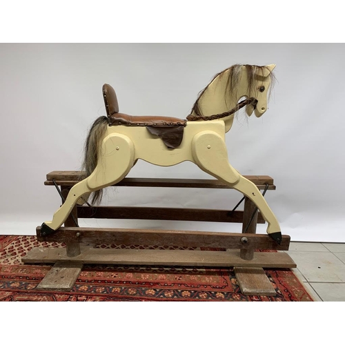 34 - A medium sized vintage wooden rocking horse. 122cm long x 110cm high