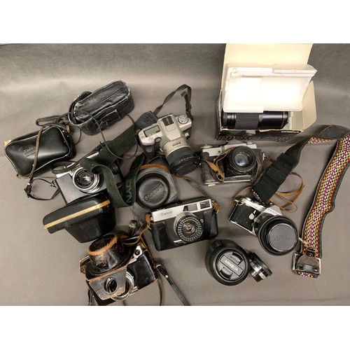 5 - A box containing 6 SLR cameras and lenses