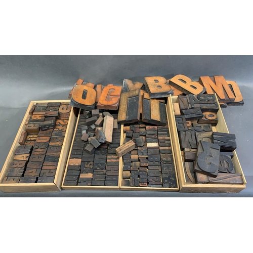 8 - A box of a antique wooden printing block letters of various sizes