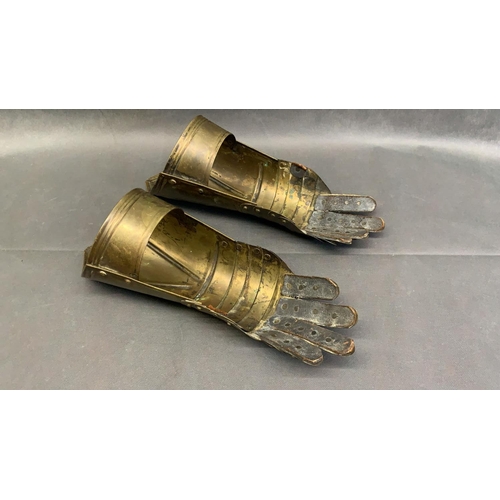 91 - A pair of Medieval replica brass gauntlets