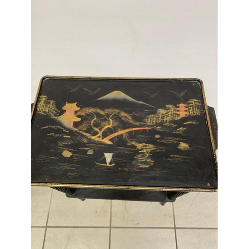 258 - An antique oriental side table on brass casters