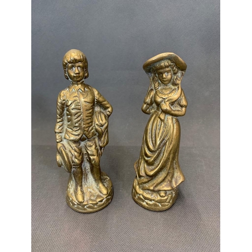 42 - A pair of antique solid brass figurines of a boy and a girl