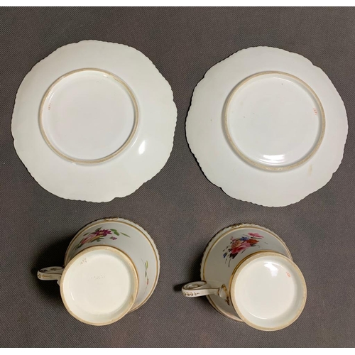 159 - A pair of cups and saucers 18th or 19th century, with floral decoration, predominately rose colour, ... 